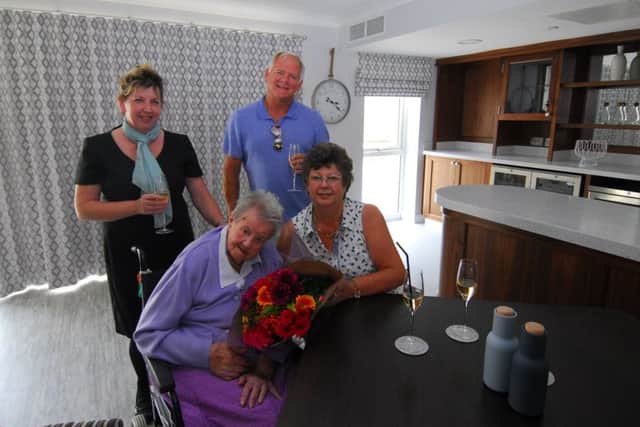 New resident Enid Walker, 99, and daughter Jenny Wizman, are pictured being welcomed by home manager Hazel Whittaker and managing director Kent Phippen. EMN-180726-164019001