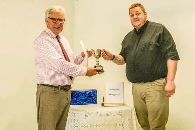 Council Chairman Jonathan Franks is pictured presenting the 2018 Leasingham Villager of the Year Award to Mr Andrew Beswick