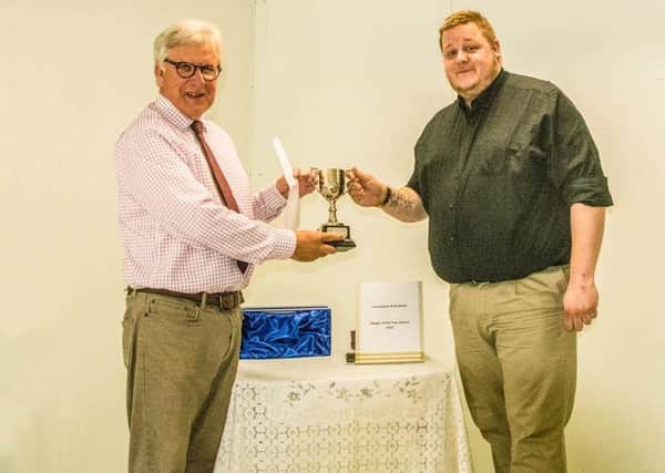 Council Chairman Jonathan Franks is pictured presenting the 2018 Leasingham Villager of the Year Award to Mr Andrew Beswick