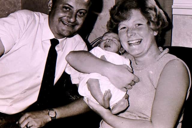 New moon landing baby Gary Wilson with his proud parents 49 years ago after they won a competition inthe Sleaford Standard. EMN-180727-220753001