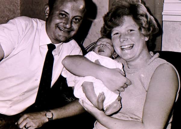 New moon landing baby Gary Wilson with his proud parents 49 years ago after they won a competition inthe Sleaford Standard. EMN-180727-220753001