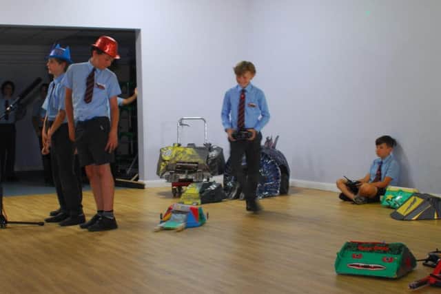 Roboteers put their machines through their paces in rehearsals.