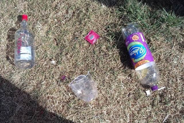 Litter left on the open space area beside the river. EMN-180725-122454001
