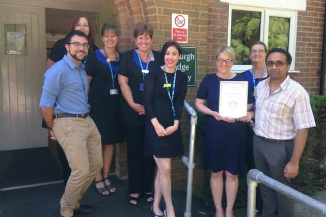 Staff at Tasburgh Lodge Surgery, in Woodhall Spa, with the award. EMN-180725-150849001
