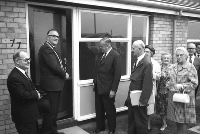 Mayor of Boston Coun Bruce Veal opens the door of 77 Staniland Road, one of the first of 40 bungalows being built in the street for Boston Corporation 50 years ago.