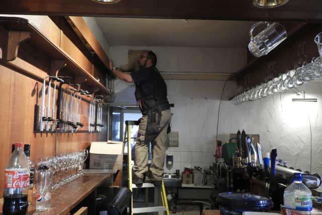 Hard at work - volunteers and tradesmen give up their time for free to get The Duke of Wellington ready to reopen. EMN-180726-101232001