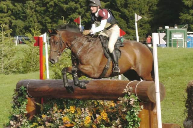 Caroline Peatfield tackles a cross country course with Henry VI EMN-180730-103922002