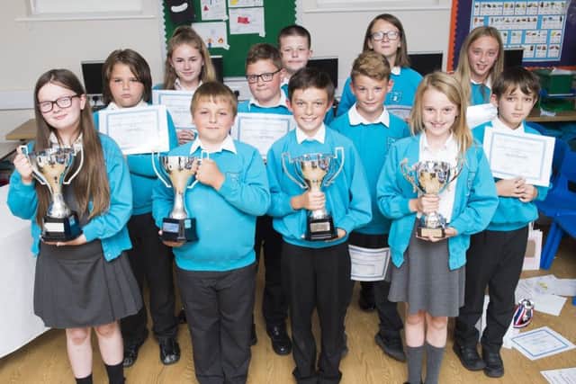 Theddlethorpe Academy Year 6 winners,(front row), with their Year 6 classmates. All pupils received a gift from Tollbar Multi Academy Trust.