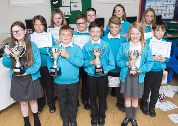 Theddlethorpe Academy Year 6 winners,(front row), with their Year 6 classmates. All pupils received a gift from Tollbar Multi Academy Trust.