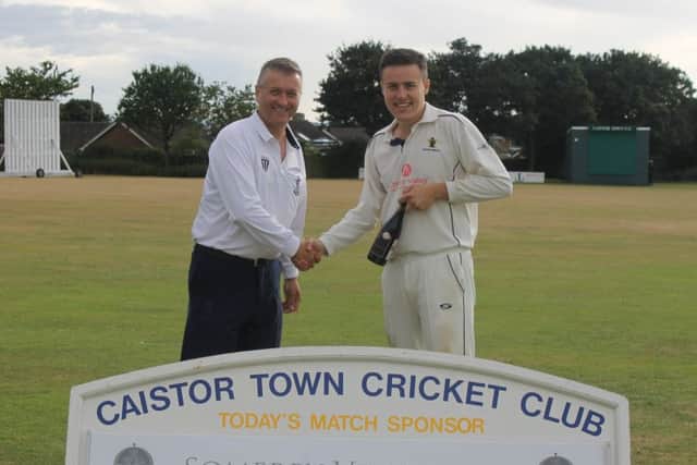 Market Rasen umpire Simon May presents First XI skipper Kieran Brooker with the man-of-the-match award, sponsored by Somerby Vineyards EMN-180730-112242002