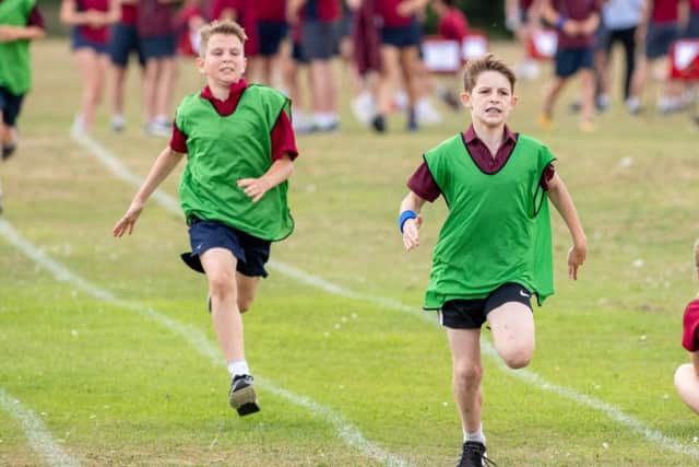 Alfie Wetton and Harry Bryant, Year 7, in the track event. EMN-180730-145804001