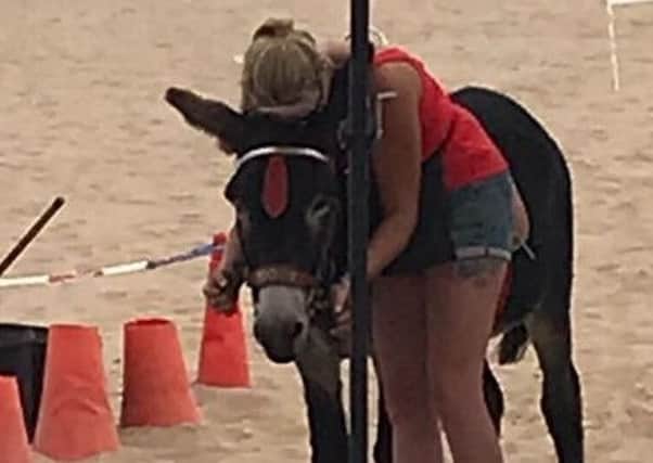 The moment it all became too much for a donkey handler on Skegness blasted on social media for sticking up for her boss when operators were alleged to have worked them during the heatwave without water and shelter. ANL-180730-154702001