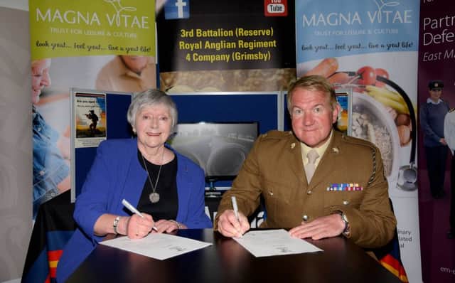 Doreen Stephenson, Chairman of Magna Vitae, signing the Covenant alongside Major Mitch Pegg.