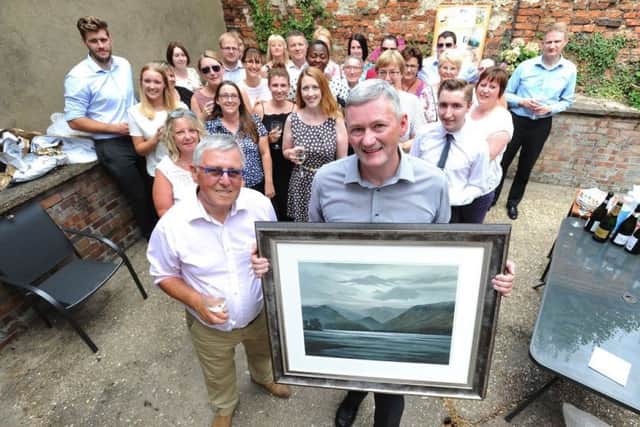 Robert Alcock holding the frame with Patrick Cordingley (left) and the rest of the Horncastle team. EMN-180731-160748001