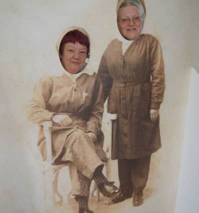 Volunteers take advantage of the heritage photo booth at the Wolds Women of Influence exhibition.