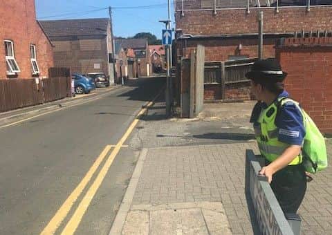 PCSO Michelle Collins looks down Prince George Street - an alleged hotspot for drinkers and drug takerrs. ANL-180208-123144001