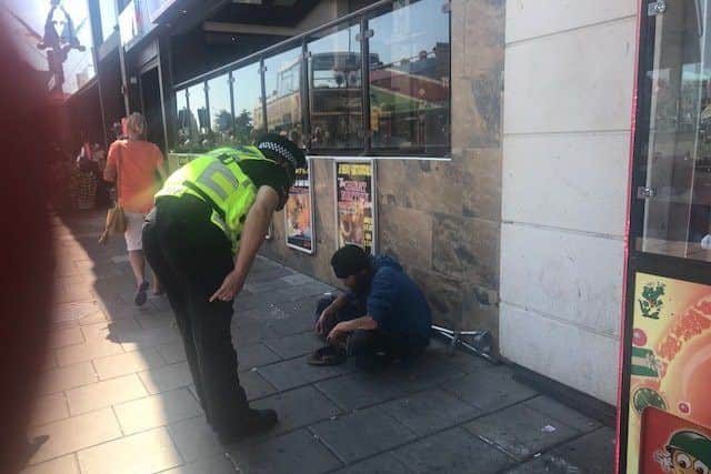 A homeless person is advised about begging in the streets. ANL-180208-123042001