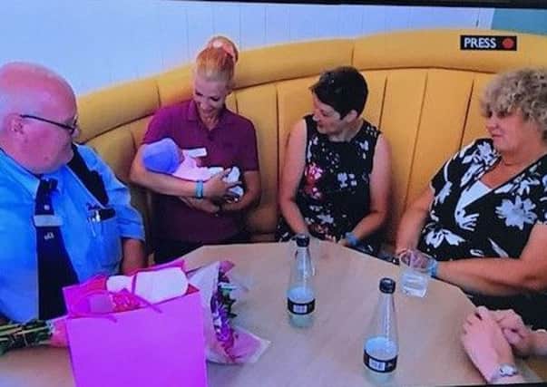 Little Evie is reunited with the staff who delivered her, with mum Rachel and  friend Jill Cave - as seen on BBC Look North. ANL-180408-075202001