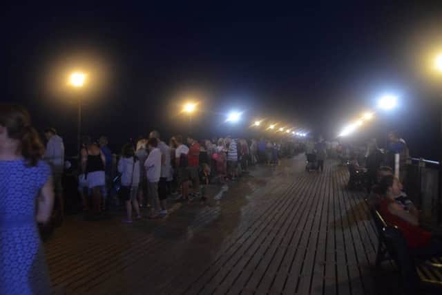Crowds gather on Skegness Pier for the fireworks displays. Photo: Barry Robinson. ANL-180408-083742001