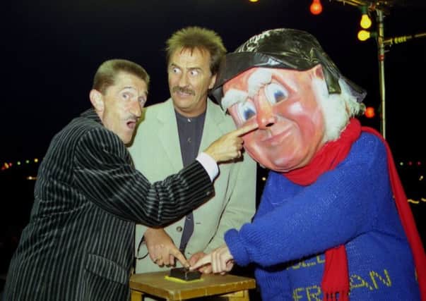 Barry Elliott (left) pictured with his brother Paul and the Jolly Fisherman switching on Skegness Illuminations in July 1997 on the rostrum at the Clock Tower. Photo: Ben Hardaker ANL-180508-122513001