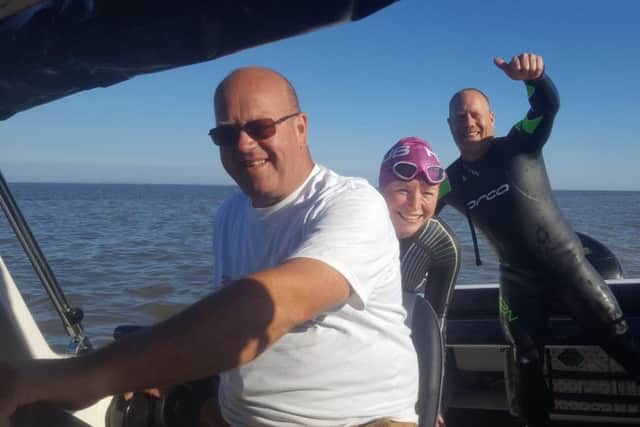 Claire Draper with her team heading out for a practice swim. ANL-180728-111353001