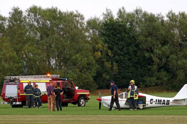 Emergency services were called to the scene. Picture: The Europa XS Monowheel light aircraft (G-IMAB) after it collapsed.