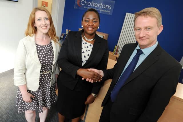 Ejiro Efekodo with new work colleagues Roly Freeman and Emma Blow . Chattertons Horncastle office