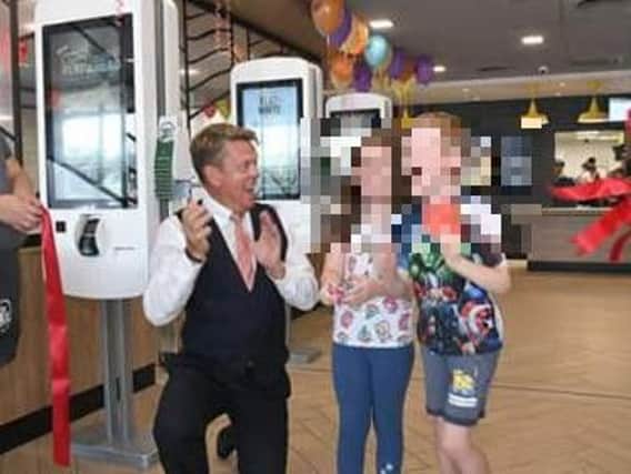 Celebrations at the re-opening of McDonald's in Boston. Children were in the restaurant when a staff member was attacked by two men last night.
