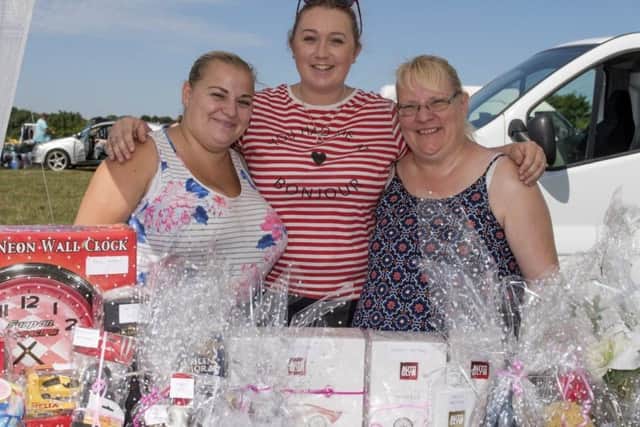 Raffle tickets on sale by Paula Bonnett, Elaine Bonnet and Laura Ringrose to raise money for the Demi Knight Treatment Fund.