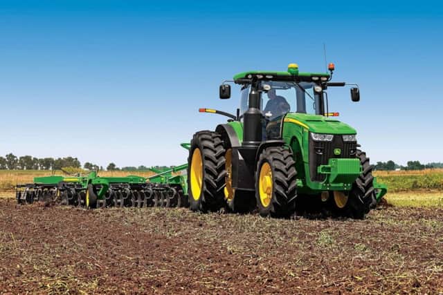 A stock image of a John Deere tractor. EMN-180813-113801001