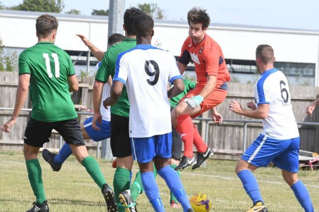 Goalkeeper Chris Adams comes out to snuff out some danger as South Normanton edge the first half EMN-180813-153336002