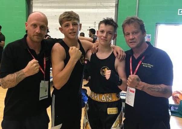 Coaches Matthew Mooney and Jonny Butler with Boxers Coby Brown and Dylan Harmon.