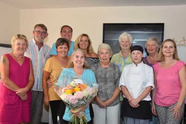 Valerie Betts (centre) with staff at Willian House. EMN-180813-171232001