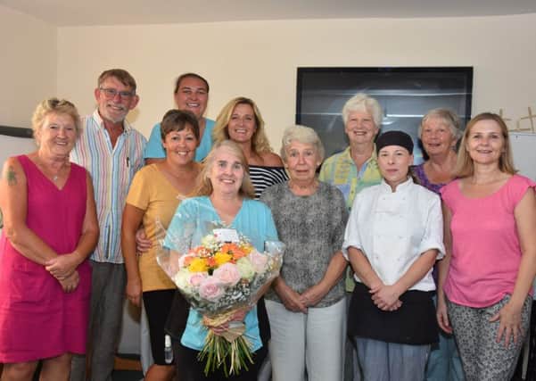 Valerie Betts (centre) with staff at Willian House. EMN-180813-171232001