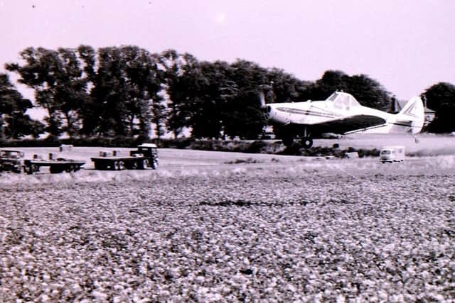 Aerial crop spraying blighted potato fields in Heckington in August 1969. EMN-180817-005551001