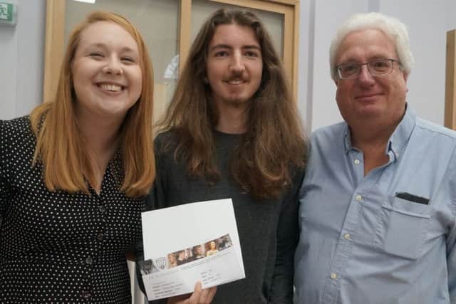 Joshua Parkinson got the highest mark in English at De Aston and celebrated with his dad Tony and head of English Sarah Peacock. Joshua plans to study politics at Sheffield. Mrs peacock said: "Joshua has worked really hard and has taken part in a lot of extra curricular events, particularly the debating group. Well done Joshua." EMN-180816-093504001
