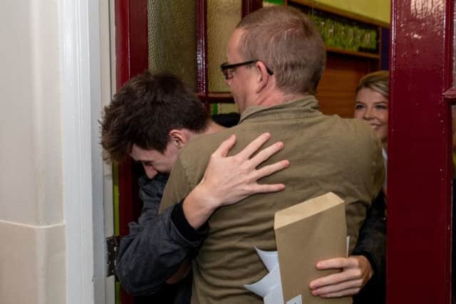 Happy hug for this student after collecting his results.
