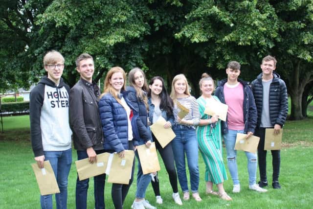 Group photo of students receiving their A-Level results at QEGS Alford.