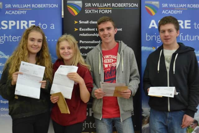 Olivia Calver-Bridge - from Greylees near Sleaford, Chloe Spencer, Ben Little and Ethan Ayling with their results at Sir William Robertson Academy. EMN-180816-123908001