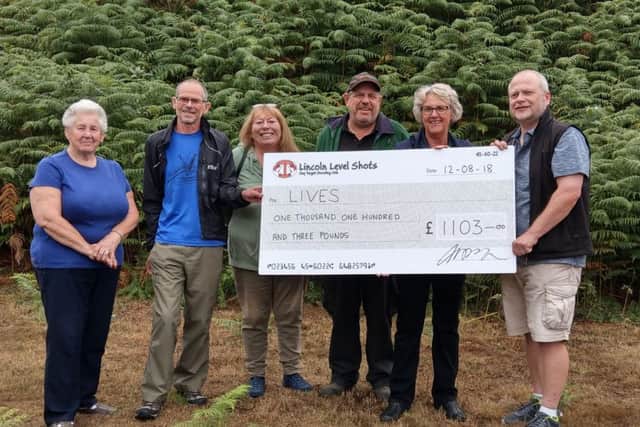Presenting the cheque for £1,103 to Gill Bennett of Holton le Moor LIVES group EMN-180820-182636001