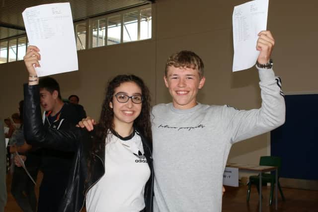 GCSE Results Day - Cordeaux Academy. Pictured are students Amelia Forman and Dylan Smith. Photo: Chloe West.