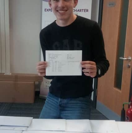 Peter Bell, of Skegness, collecting his GCSE results at Skegness Academy. ANL-180823-104230001