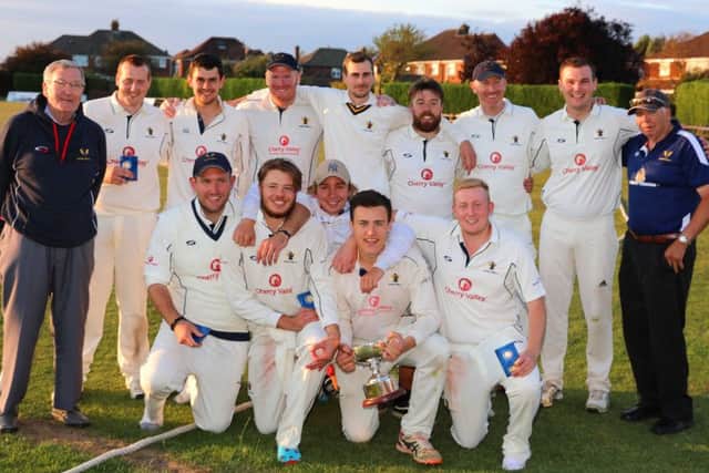 Caistor CC celebrate with the George Marshall Trophy EMN-180823-111253002