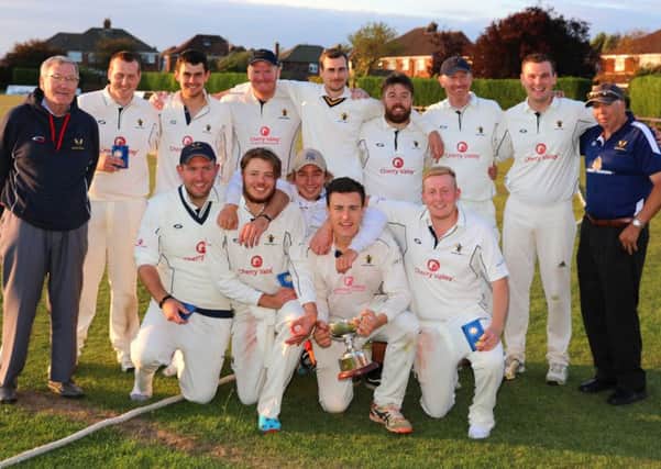 Caistor CC celebrate with the George Marshall Trophy EMN-180823-111253002
