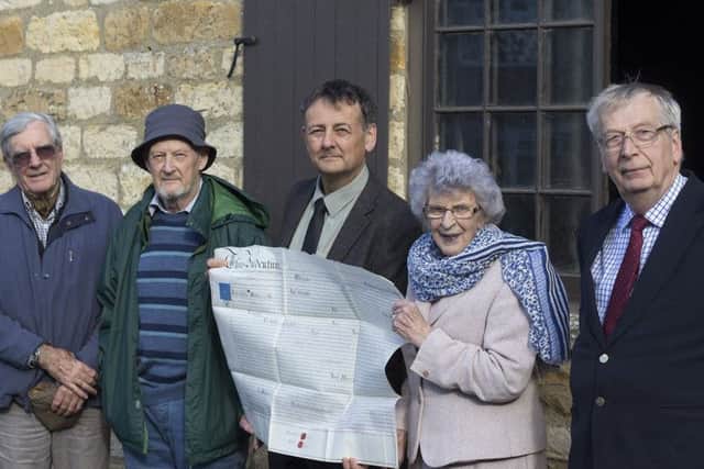 A staunch supporter of heritage in the district, Coun Marion Brighton, is picturedwith members of Welbourn Parish Council and the deeds for Welbourn Forge.