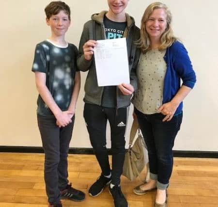 Sam Blair celebrates with brother Joe (14) and Mum Julie.