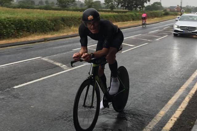 Heatwave? What heatwave? Chris during the bike section of his first of epic charity effort.