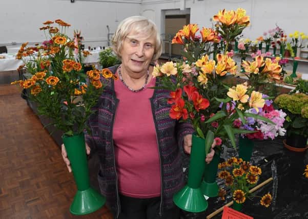 Show secretary Pat Rowett with her flower displays. EMN-180827-090919001