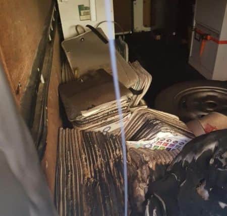 Damaged sample books in the van. ANL-180827-115954001