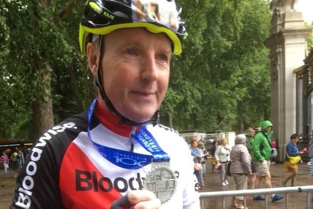 Mablethorpe RC chairman Wayne Kew dons the velcro for Ride London EMN-180827-125430002
